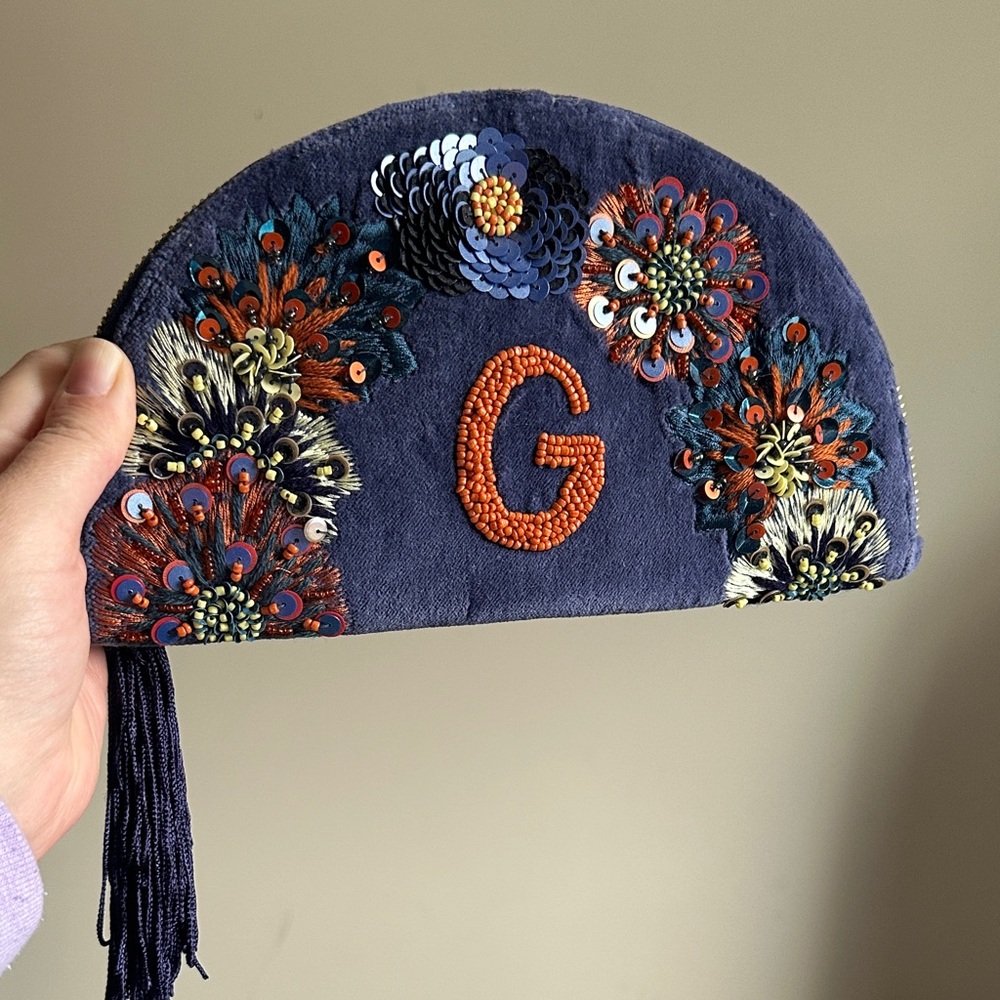 Anthropologie Navy and Orange Embroidered Clutch with Tassel “G”